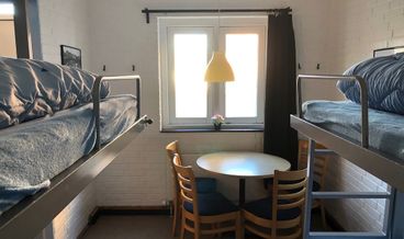 Bild på Basic Triple Room, Private Bathroom-1 Twin Bed and 1 Twin Bunk Bed Free WiFi Free self parking