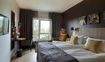 Bild på Standard Triple Room-1 Double Bed and 1 Twin Trundle Bed Free WiFi Free self parking Free breakfast