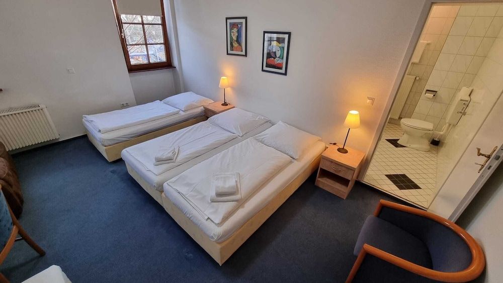 Bild på Comfort fyrbäddsrum - privat badrum - utsikt mot staden